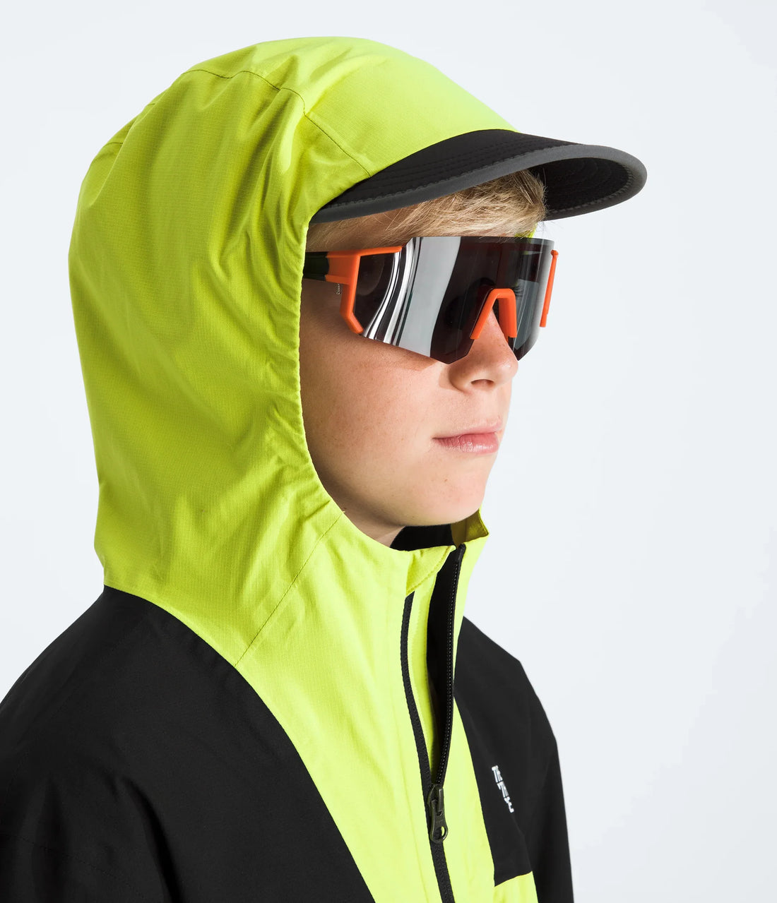 The North Face Boys' & Girls' Hike Packable Shell - TNF Black/Fizz Lime - close-up of the hood worn over headgear