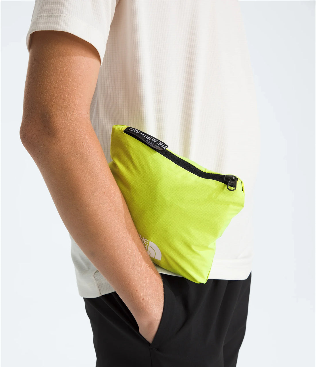 The North Face Boys' & Girls' Hike Packable Shell - TNF Black/Fizz Lime - shell stowed in its pocket