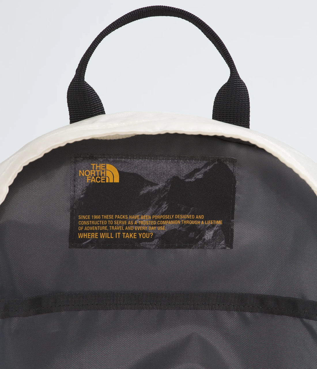 The North Face Hot Shot Mini Pack - 12L - White Dune/Desert Stone - interior label and top opening