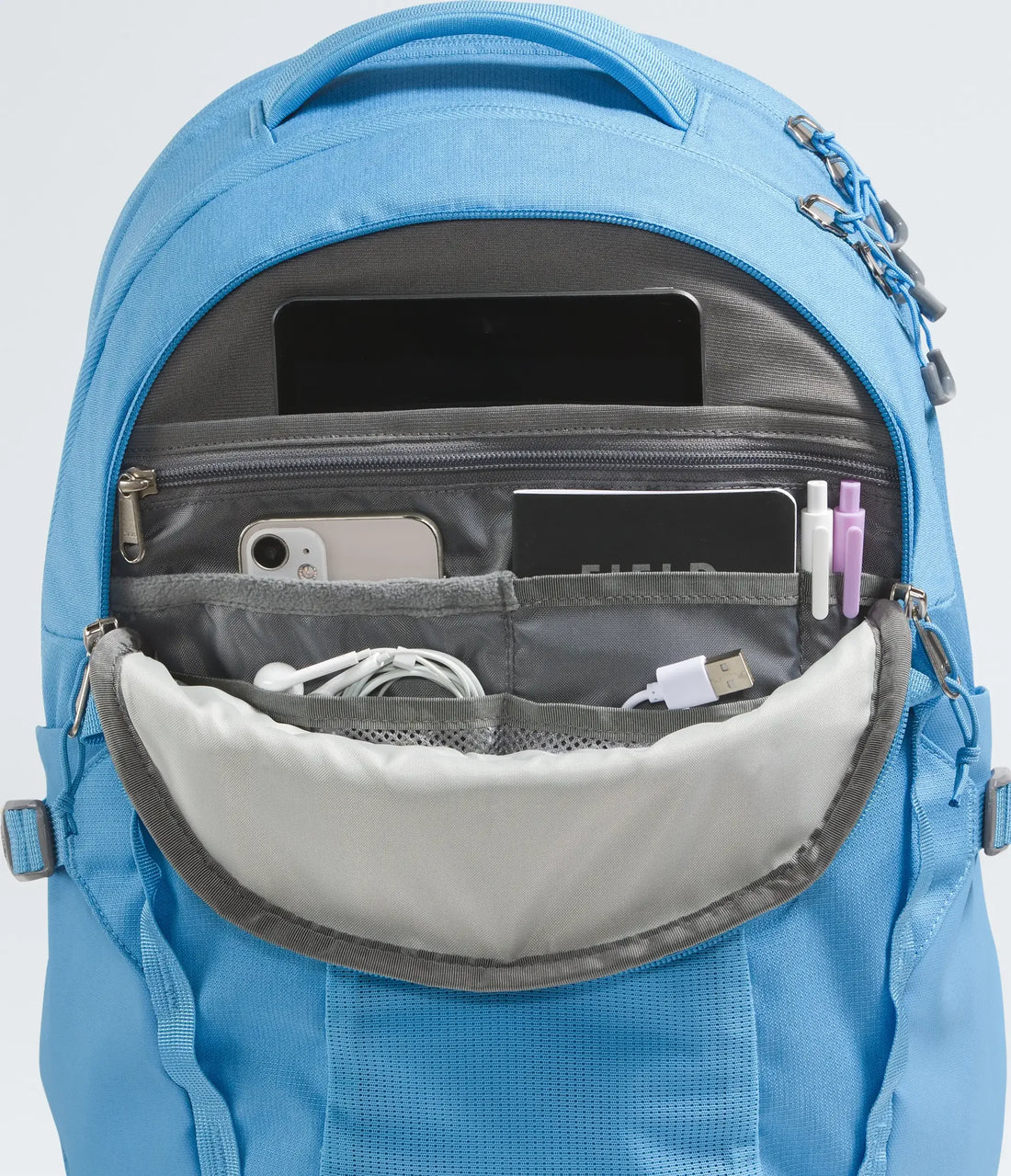 The North Face Women's Recon Backpack - 30L - Dark Cornflower Dark Heather - front organiser pocket with example contents