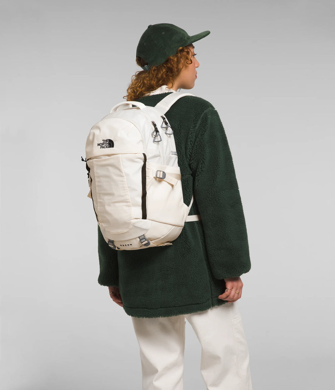 The North Face Women's Recon Backpack - 30L - Gardenia White/TNF Black - carried by a model