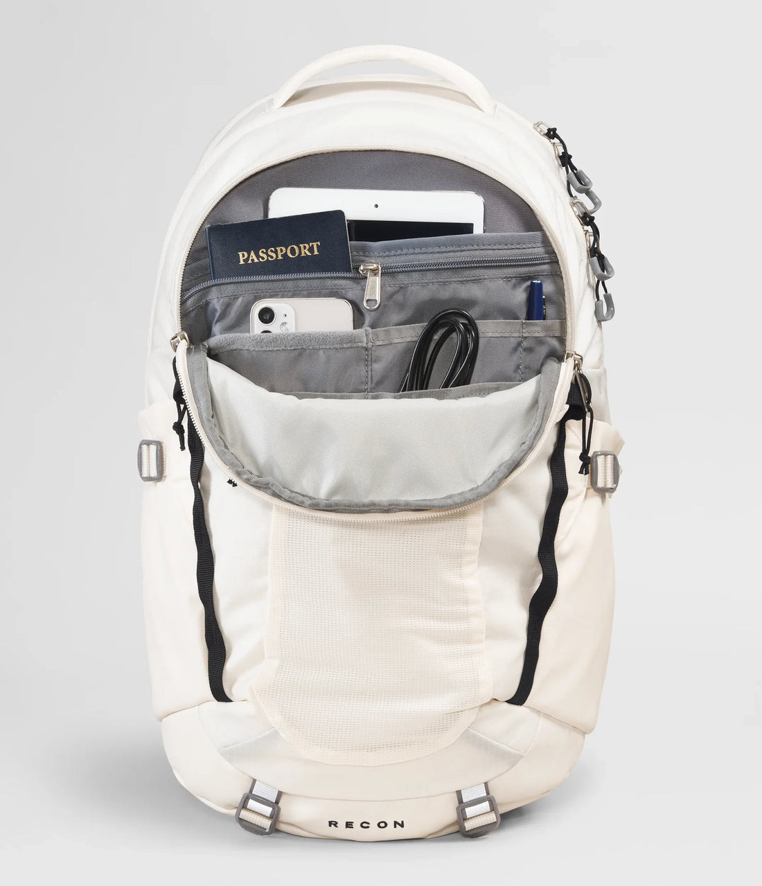 The North Face Women's Recon Backpack - 30L - Gardenia White/TNF Black - front organiser pocket with example contents