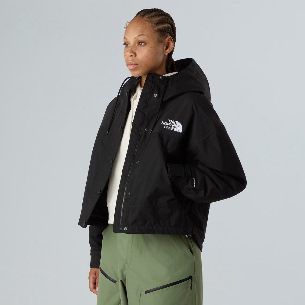 The North Face Reign On women's black rain jacket with hood and front zipper.