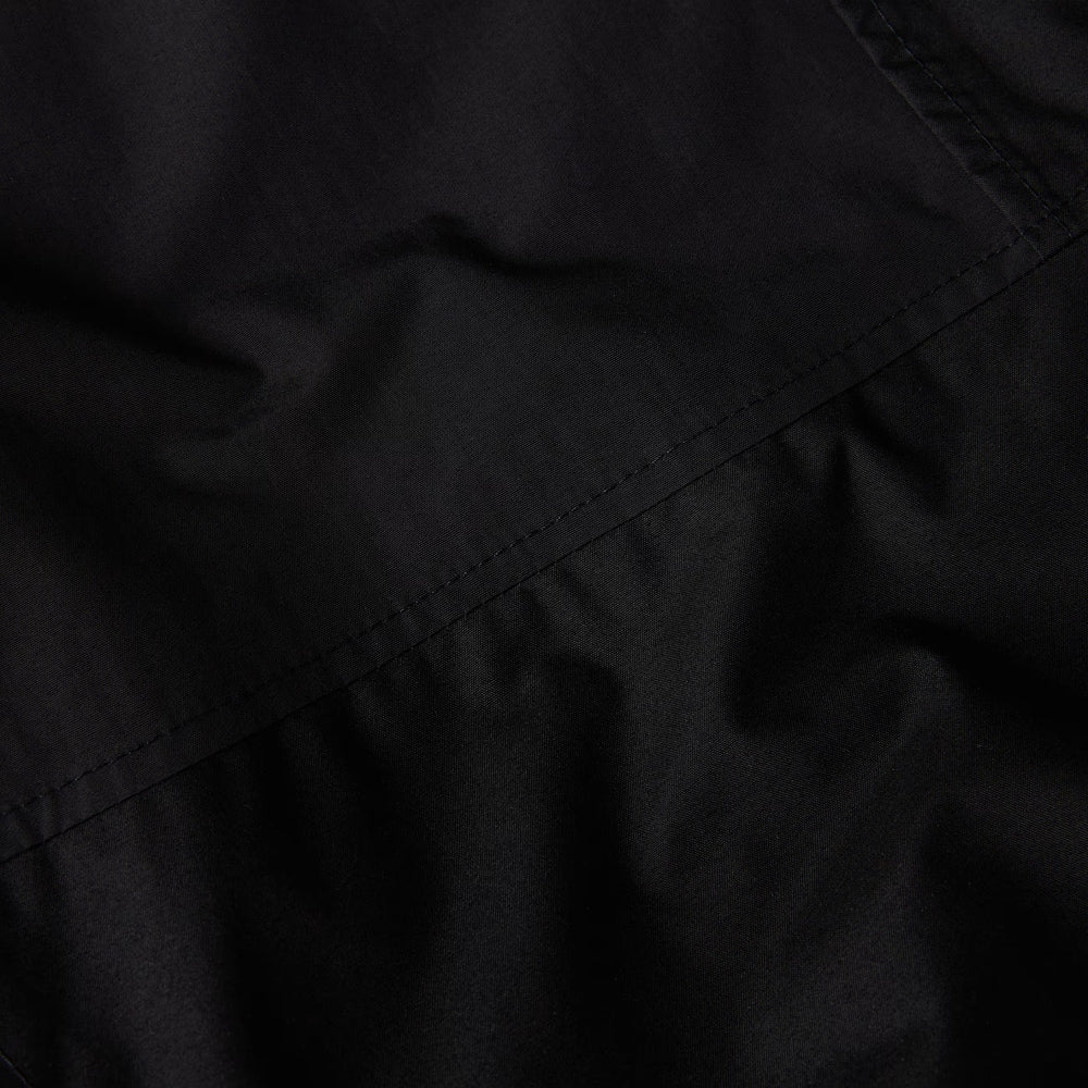 The North Face Women's Reign On Jacket in black, waterproof rain coat with diagonal seam detail.