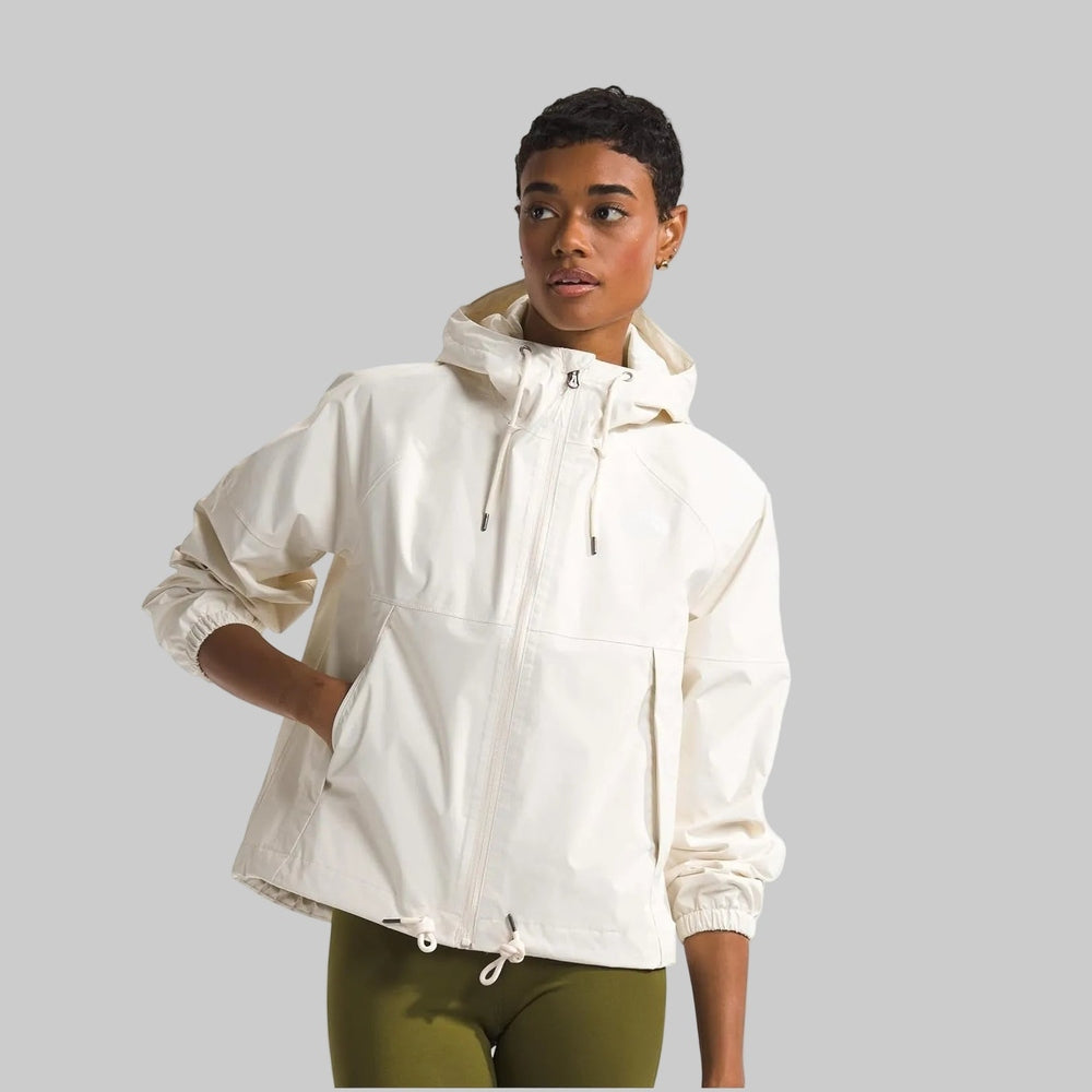 The North Face Women's Antora Rain Hoodie in Ivory with front zipper, hood drawstrings, and elastic cuffs.