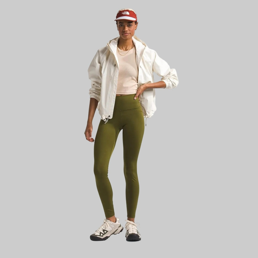 The North Face Women's Antora Rain Hoodie in White worn with olive-green leggings and a red cap.