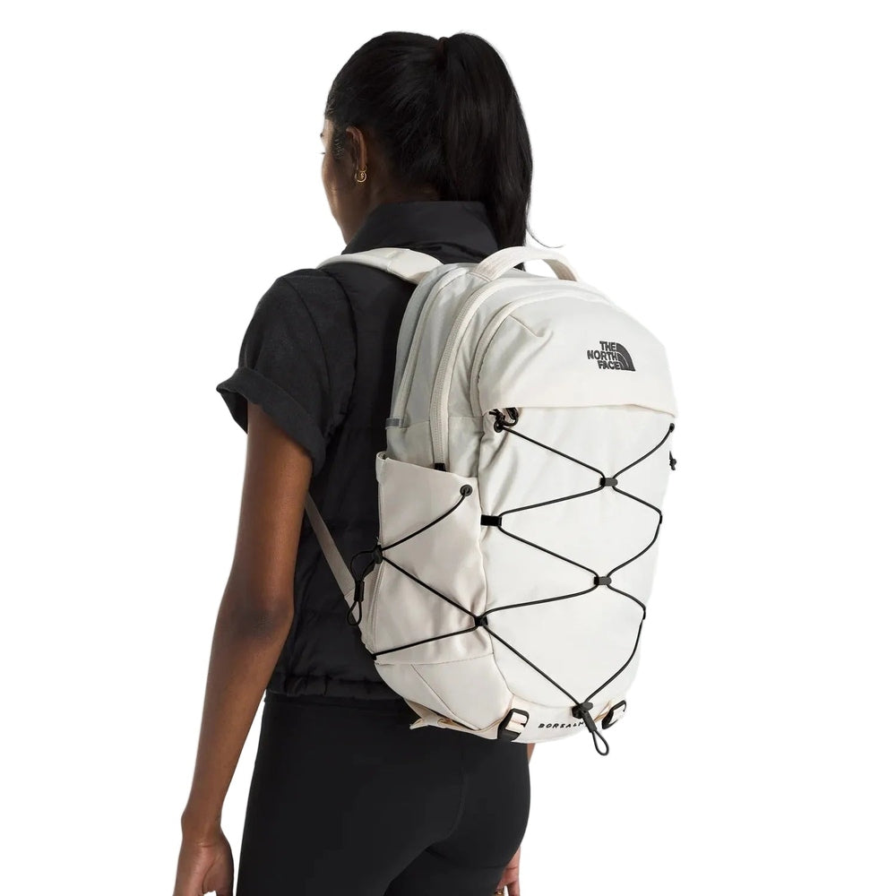 The North Face Borealis Backpack in Cream with black bungee cords