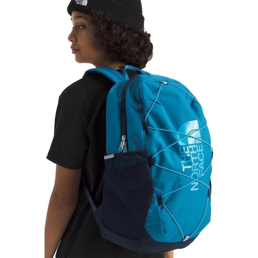 The North Face Youth Court Jester backpack in bright blue with bungee lacing and side mesh pocket