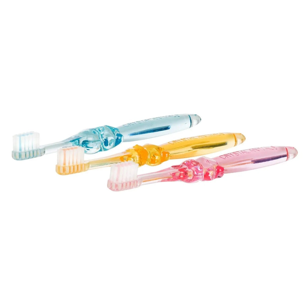 Thera Wise Crystal Animals antibacterial children's toothbrushes 0-6 yrs; three-pack with translucent blue, yellow and pink handles.