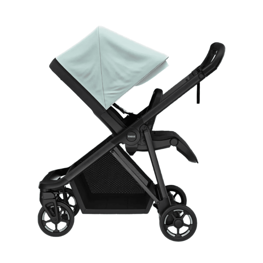 Thule Shine stroller with light blue canopy, black frame, and large undercarriage storage basket