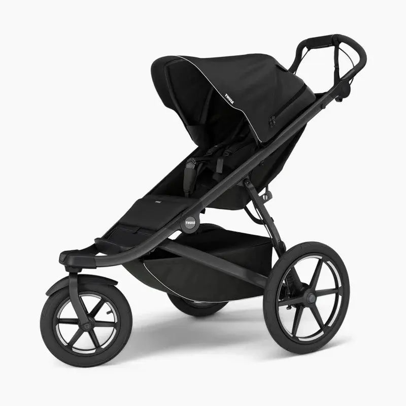Thule Urban Glide 3 stroller in black with large wheels and rugged frame ready for maneuvering