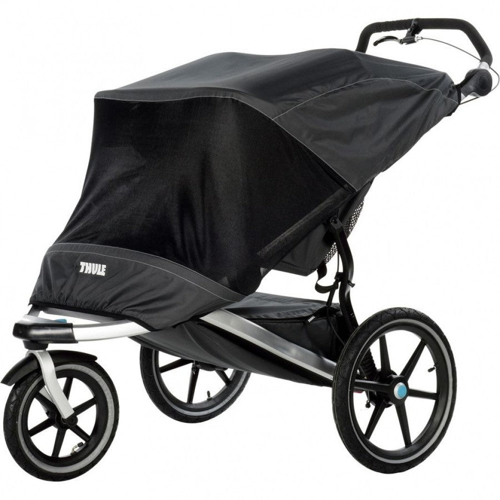 Thule Urban Glide Double Mesh Cover on a black stroller, canopy secured with mesh for ventilation and protection.