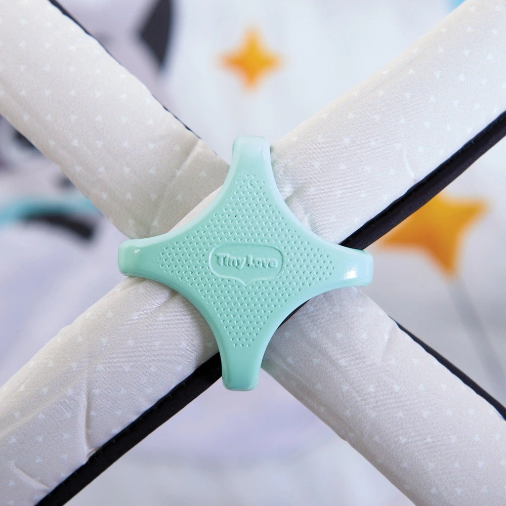 Tiny Love Magical Tales Black & White Gymini play gym cross joint in mint, joining soft white dotted bars.