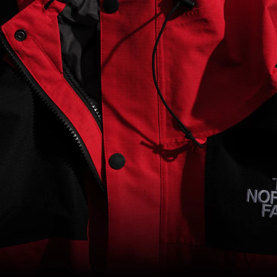 DRYVENT Mono Mountain Jacket recycled fabric detail; red/black shown in the brand's shared feature demonstration.