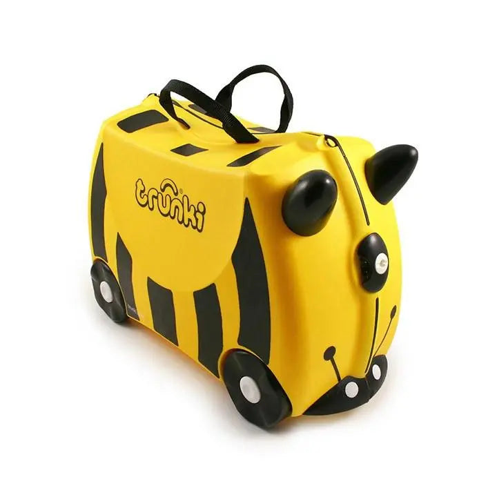 Trunki Ride On Suitcase yellow with black tiger stripes; wheels roll and carrying strap on top.