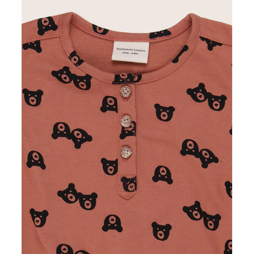 Turtledove London Two Bears Bubble Romper Sunset pink, front three-button placket with black bear prints.