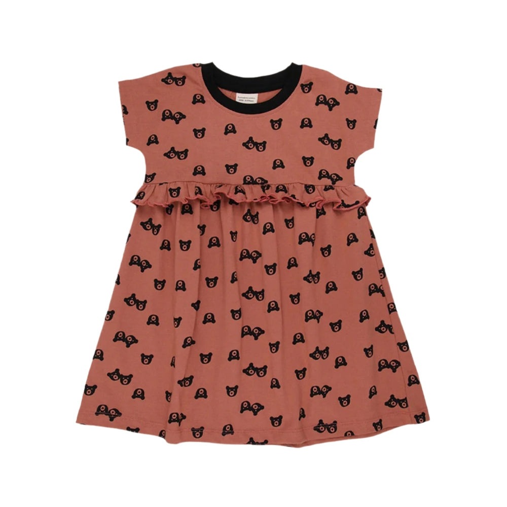 Turtledove London Two Bears Dress Sunset, salmon pink with black bear print, flat laid to show ruffled waist.