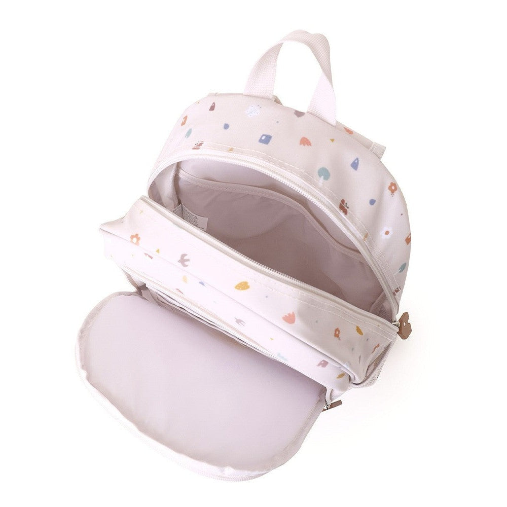 Tutete Kids Medium Backpack in pale pink with colorful shapes; top handle and front zipper pocket
