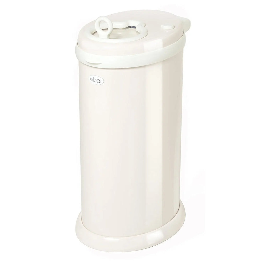 Ubbi Diaper Pail, white plastic with closed lid, circular ring handle, and footed base.