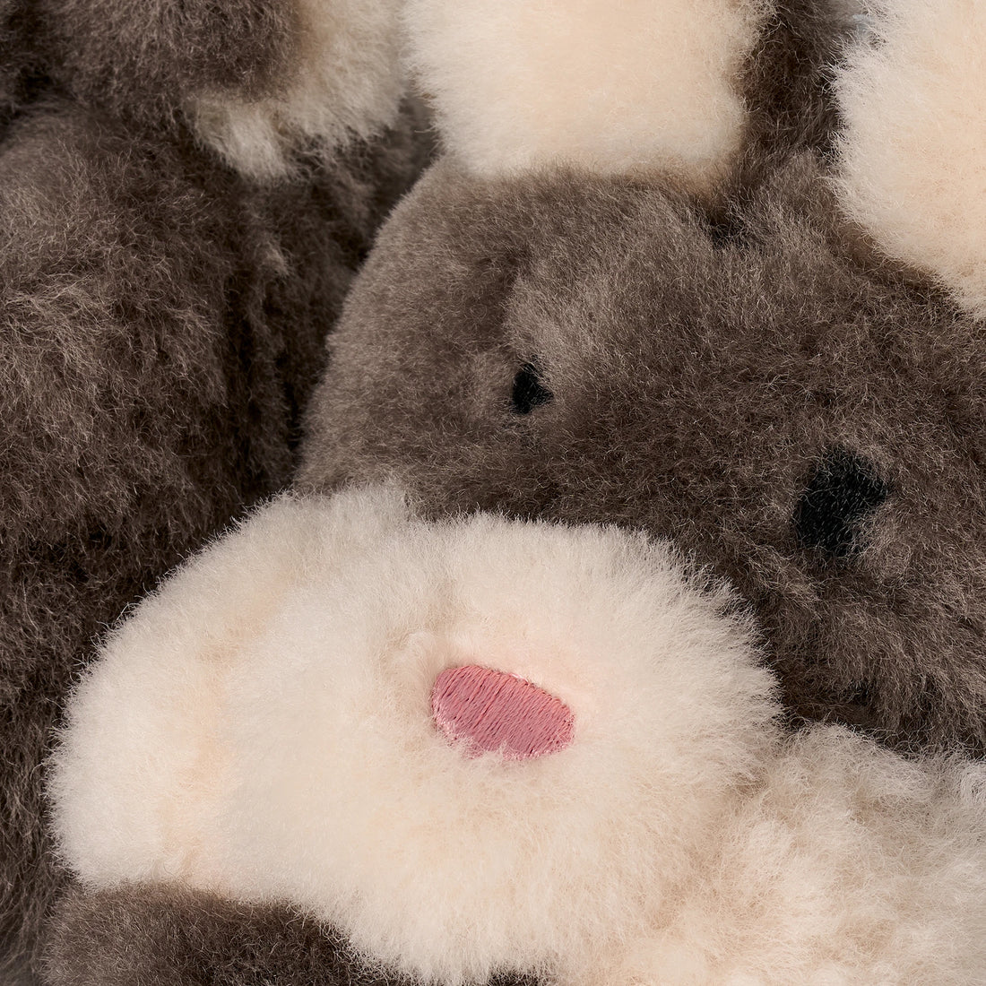 UGG Baby Hop Slipper in Slate, close-up of bunny face and ears
