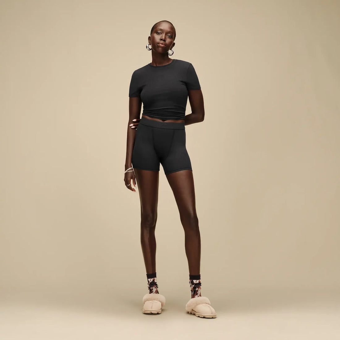UGG Coquette in Moonlight, worn with a black top and shorts