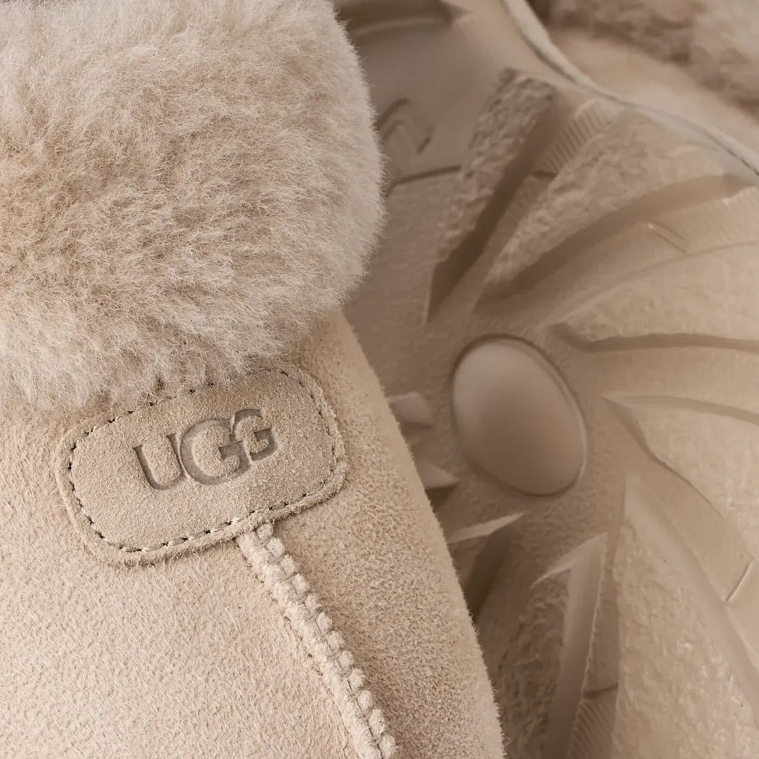 UGG Coquette in Moonlight, close-up of sheepskin cuff and embossed suede label