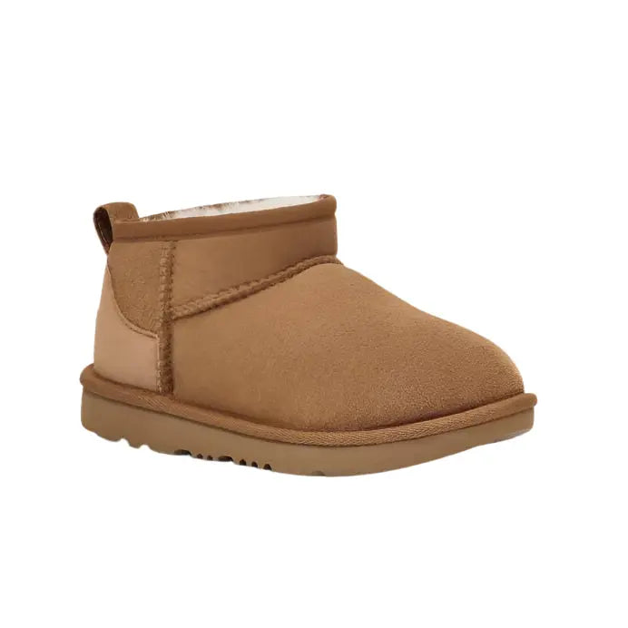 UGG Kid's Classic Ultra Mini Chestnut suede slip-on boot with plush shearling lining.