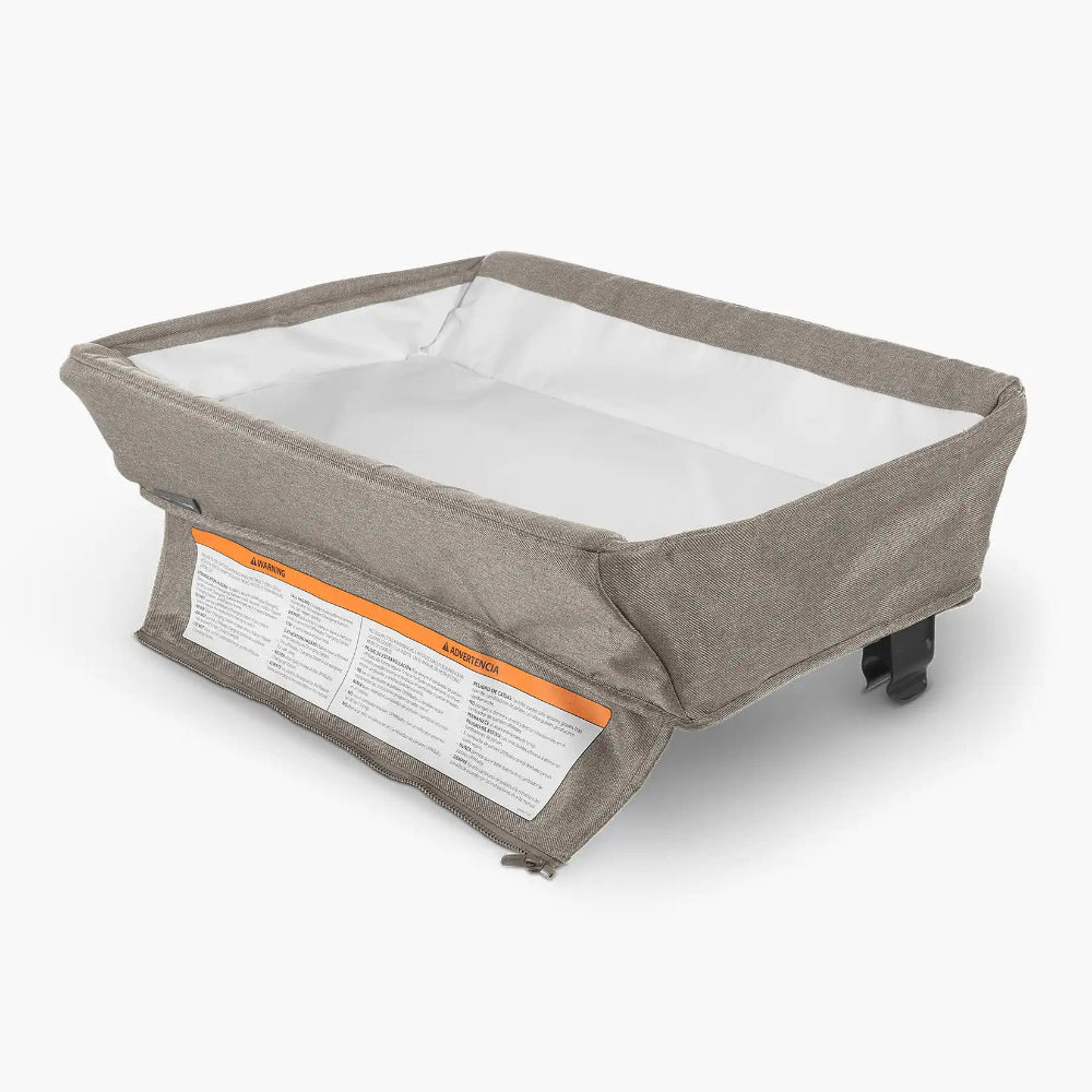 Uppababy changing station for Remi bassinet in gray fabric with white interior