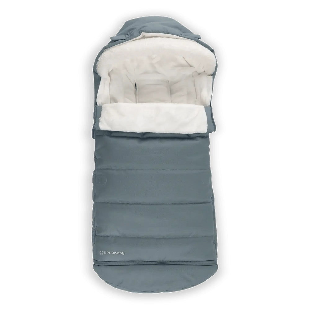 UPPABaby Cozy Ganoosh stroller footmuff in blue-gray with plush white lining, keeping baby warm.
