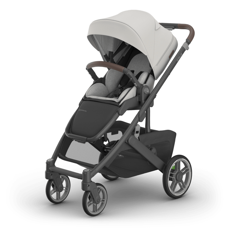 UPPAbaby Cruz V3 stroller with gray seat, white canopy, brown leatherette handlebar