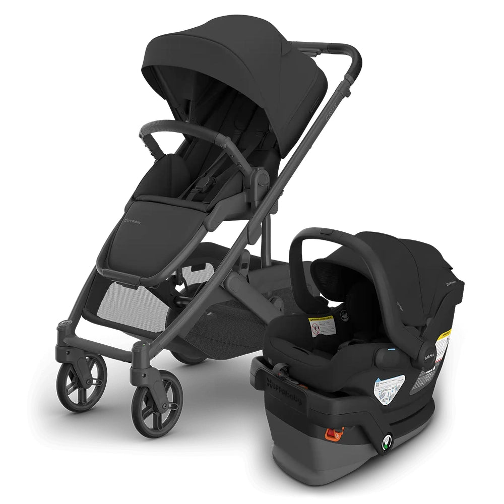 UPPABABY Cruz V3 Stroller + Mesa V3 Infant Car Seat Travel System in charcoal, stroller with extended canopy beside car seat.