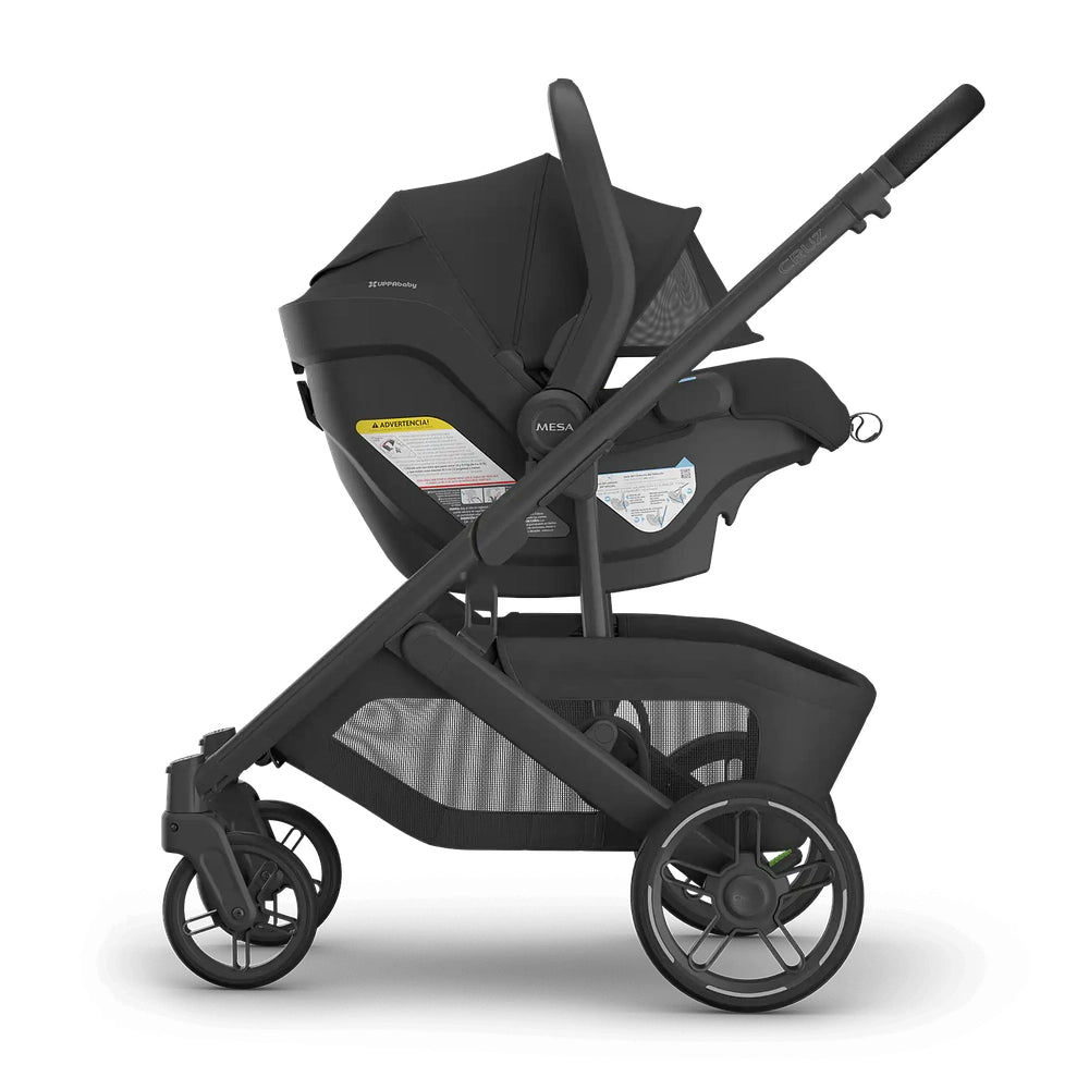 Uppababy Cruz V3 Stroller + Mesa V3 Infant Car Seat Travel System in black, car seat attached to the stroller frame.