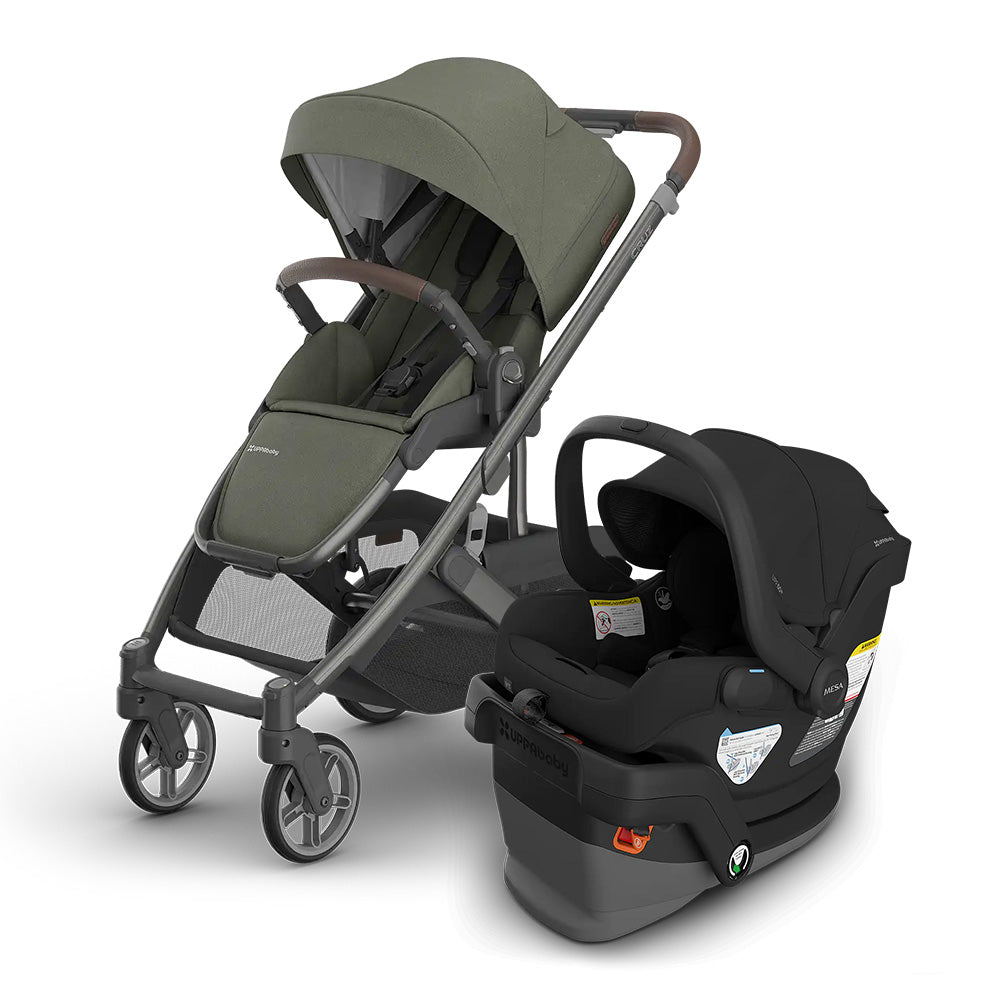 Uppababy Cruz V3 Stroller + Mesa V3 Infant Car Seat Travel System in olive green/black, stroller canopy raised beside car seat.