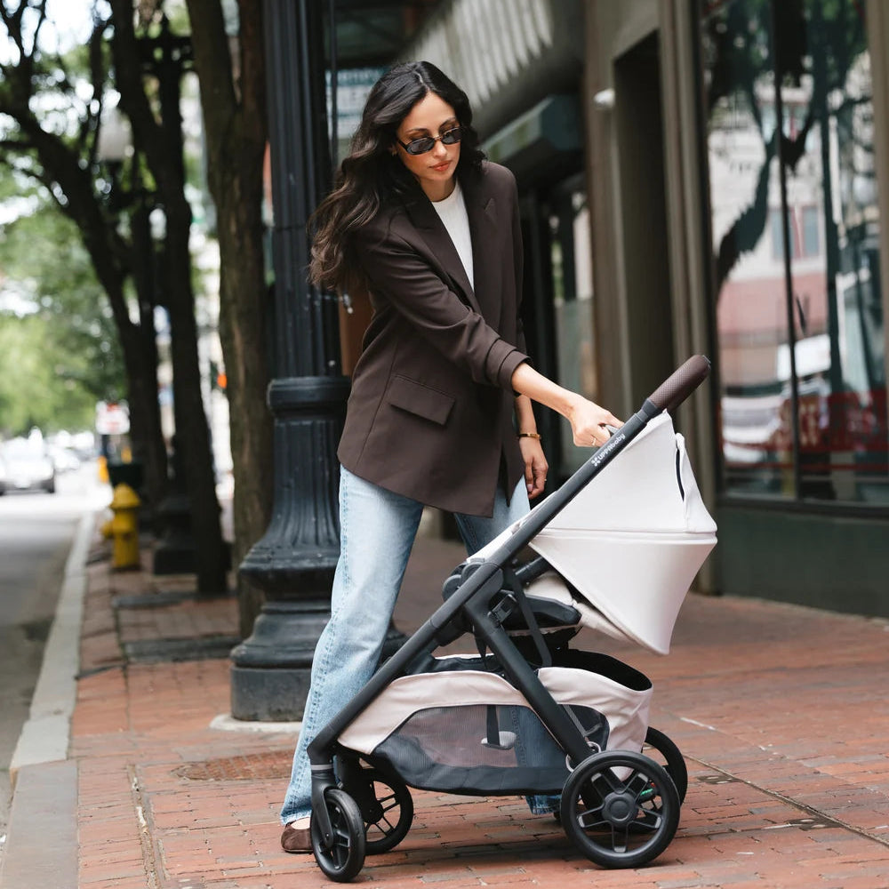 UPPAbaby Kona in Ada at the start of the fold sequence