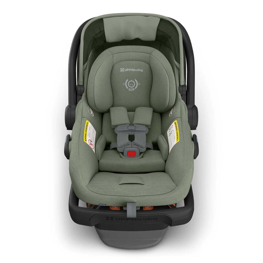 UPPAbaby Mesa V3 infant car seat in olive green with five-point harness secured to the base.
