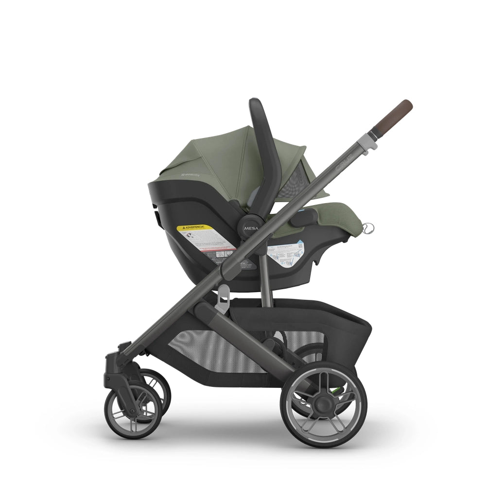 UPPABABY Mesa V3 infant car seat attached to a stroller frame with olive canopy and gray frame.