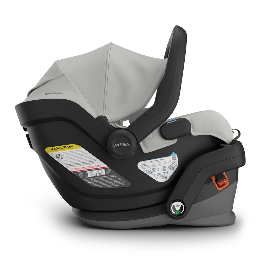 UPPABABY Mesa V3 infant car seat in gray mounted on base with ergonomic handle and orange latch lever.