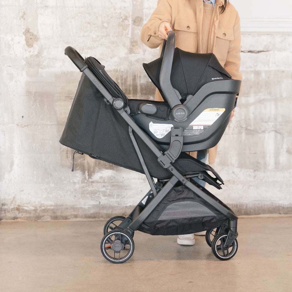 Uppababy Minu V3 stroller with bassinet in black fabric and gray frame