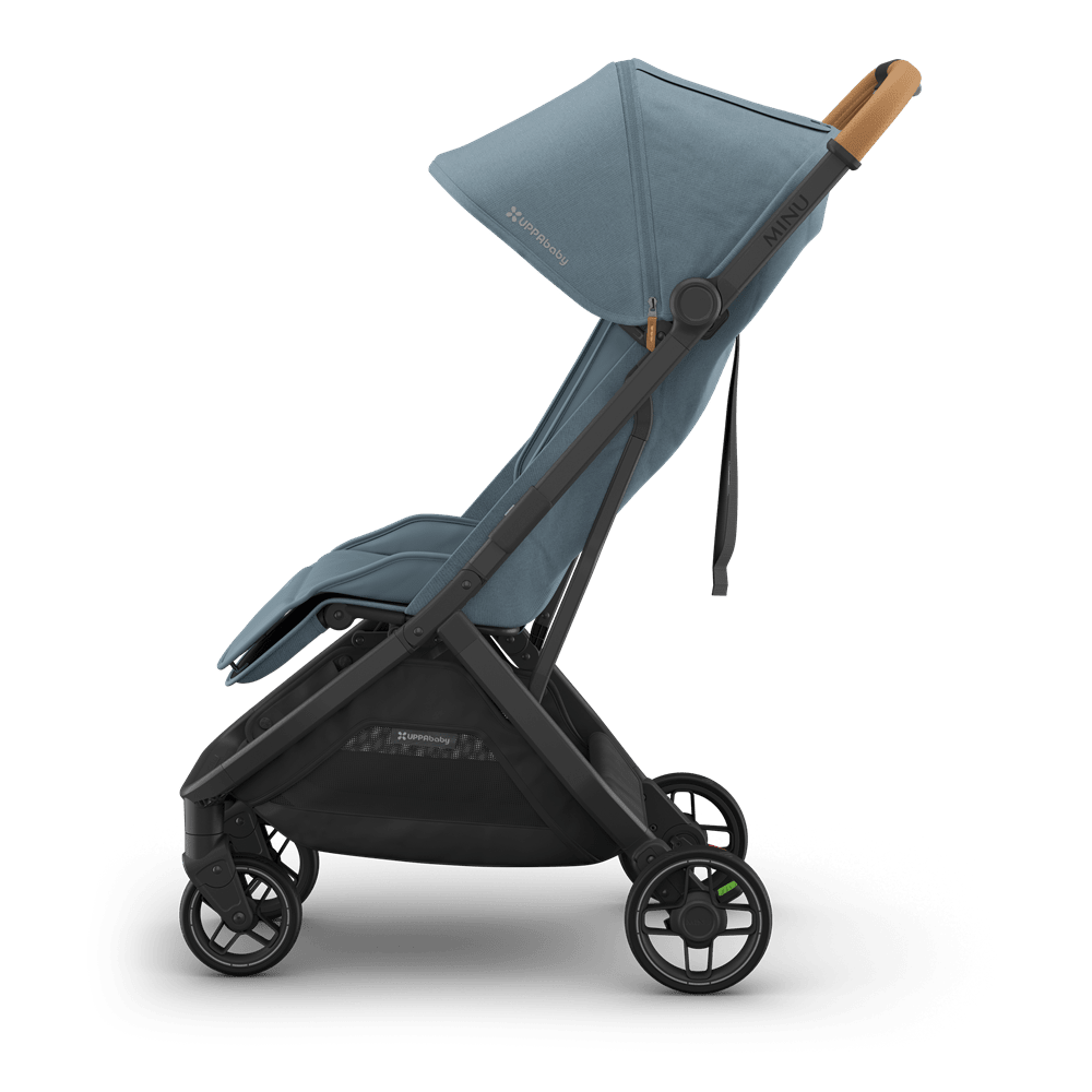 Uppababy Minu V3 stroller in blue fabric with tan leatherette handle and black frame