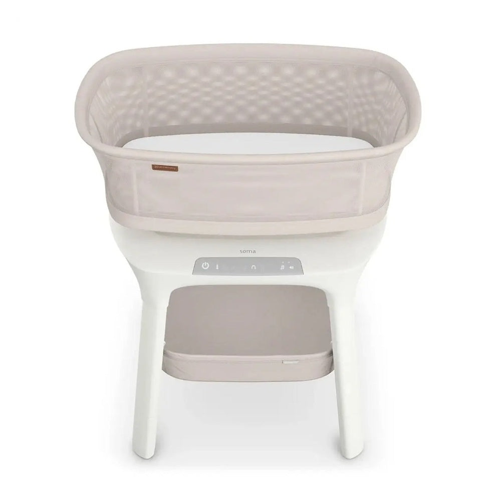UPPAbaby Soma Smart Bassinet in Blush Beige with mesh bassinet and white stand