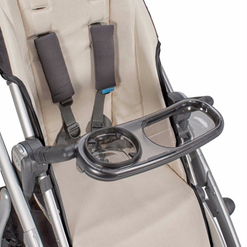 Uppababy Vista and Cruz Snack Tray attached to beige stroller with dual cup holders for easy access.