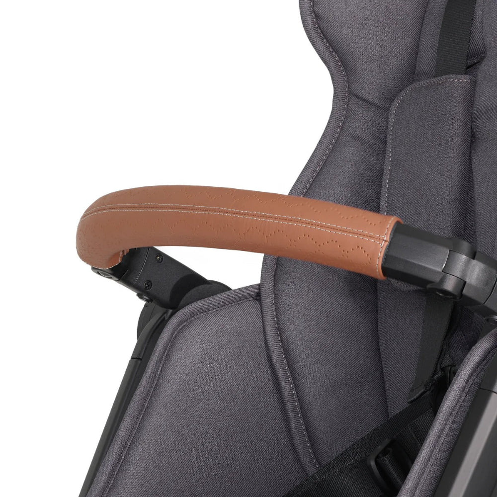 Veer Switch & Roll Leather stroller handle in brown leather on a gray frame