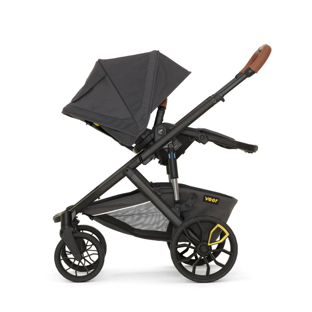 Veer Switch & Roll Leather stroller bundle in black with gray canopy and brown leather handle.