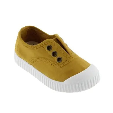 Victoria Shoes Rubber-Toecap Canvas Curry sneaker, mustard-yellow canvas with white ribbed sole and eyelet lacing.