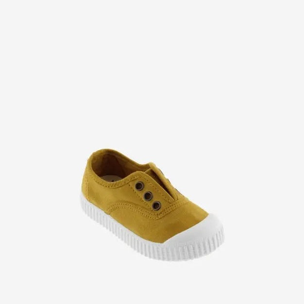 Victoria Shoes Rubber-Toecap Canvas Curry sneakers in curry yellow with a white rubber toe cap, designed for babies.