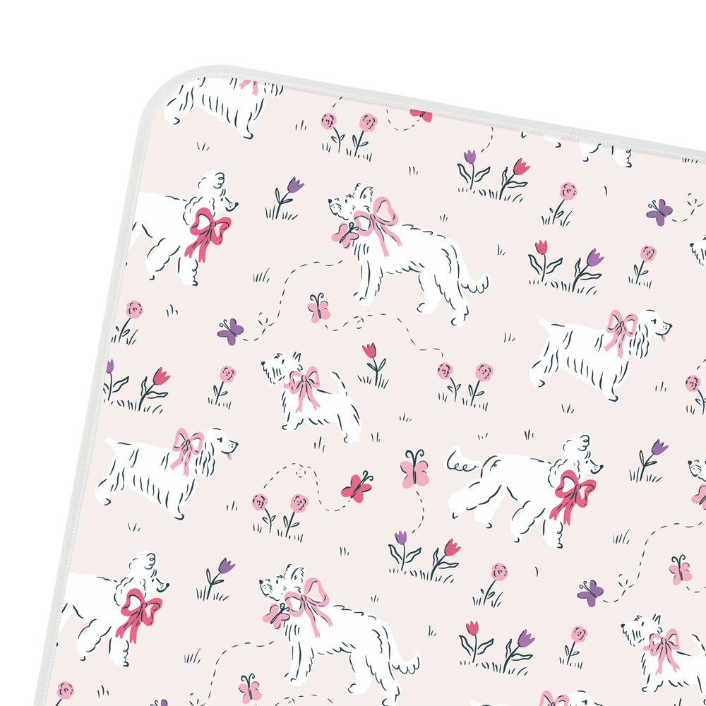 NEST DESIGNS Nest Designs Waterproof Change Pad Small Cheeky Capers white piped edge with illustrated dogs, flowers, and butterflies img 5/8