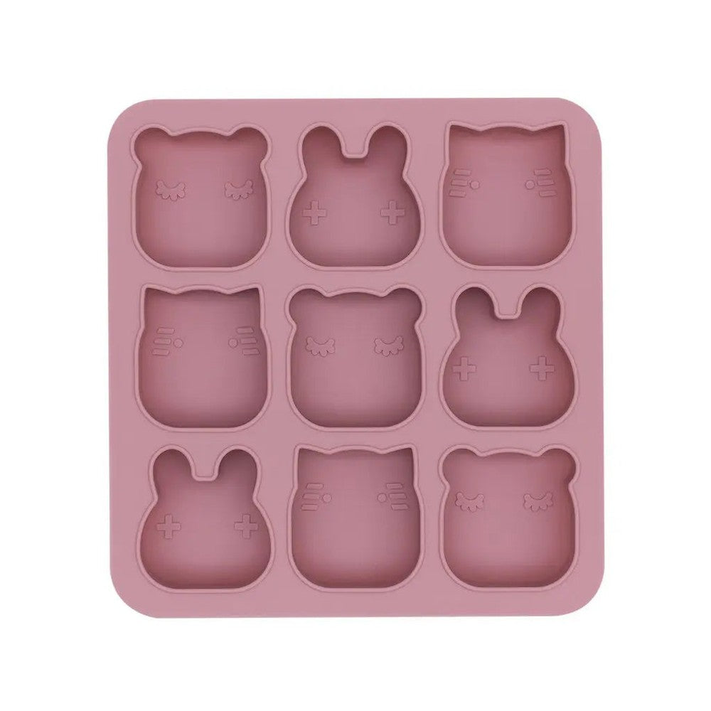 We Might Be Tiny Freeze&Bake Poddies silicone tray in pink with nine cat-shaped molds ready for freezing or baking.