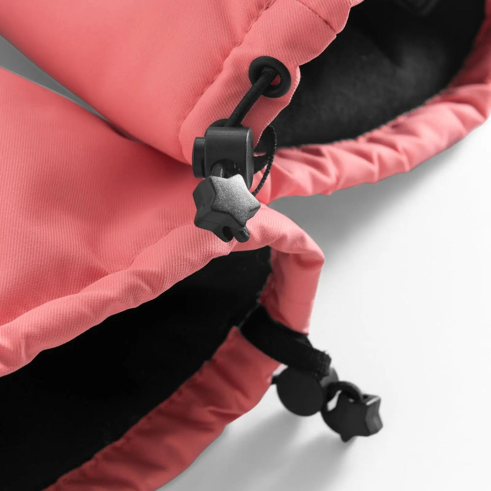 Weedo Silver Unido Mittens in pink fabric; a hand tightens black adjustable toggles on the cuff.