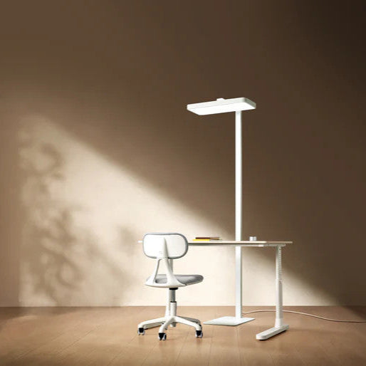 Yeelight Natural Light Floor Lamp with a white minimalist LED pole beside a white desk and chair (3 items)