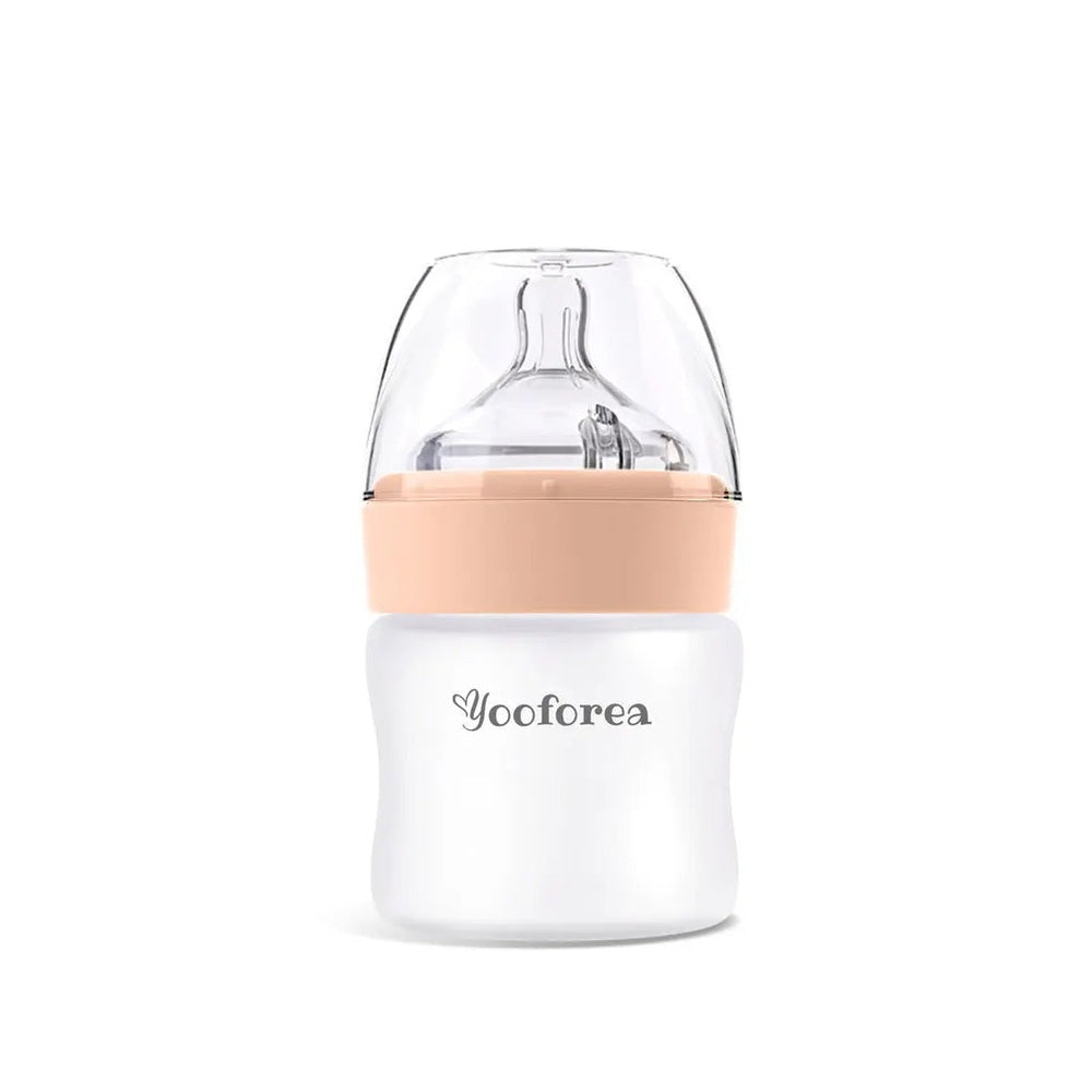 Yooforea silicone-coated glass baby bottle 3oz/90ml with peach cap, white base and logo visible.